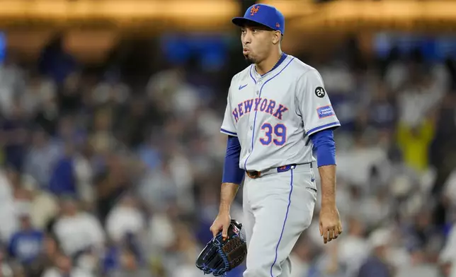 New York Mets pitcher Edwin Díaz reacts during the fourth inning in Game 6 of a baseball NL Championship Series against the Los Angeles Dodgers, Sunday, Oct. 20, 2024, in Los Angeles. (AP Photo/Julio Cortez)