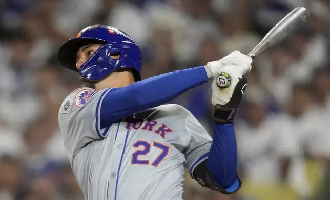 New York Mets' Mark Vientos hits a two-run home run during fourth inning of Game 6 in a baseball NL Championship Series against the Los Angeles Dodgers, Sunday, Oct. 20, 2024, in Los Angeles. (AP Photo/Ashley Landis)