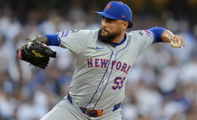 New York Mets pitcher Sean Manaea throws against the Los Angeles Dodgers during the first inning in Game 6 of a baseball NL Championship Series, Sunday, Oct. 20, 2024, in Los Angeles. (AP Photo/Julio Cortez)