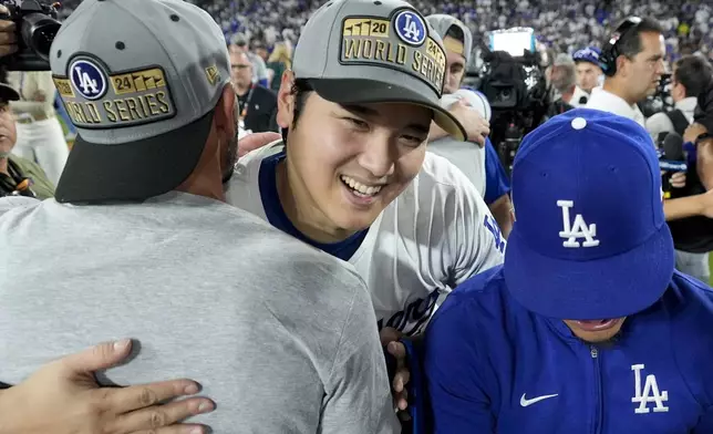 Los Angeles Dodgers' Shohei Ohtani celebrates after their win against the New York Mets in Game 6 of a baseball NL Championship Series, Sunday, Oct. 20, 2024, in Los Angeles. The Dodgers will face the New York Yankees in the World. (AP Photo/Ashley Landis)