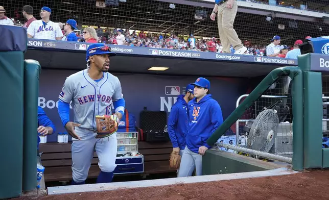 New York Mets shortstop Francisco Lindor takes the field ahead of Game 1 of a baseball NL Division Series against the Philadelphia Phillies, Saturday, Oct. 5, 2024, in Philadelphia. (AP Photo/Chris Szagola)