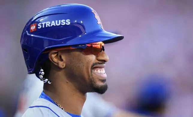 New York Mets' Francisco Lindor smiles during of the first inning of Game 2 of a baseball NL Division Series against the Philadelphia Phillies, Sunday, Oct. 6, 2024, in Philadelphia. (AP Photo/Chris Szagola)