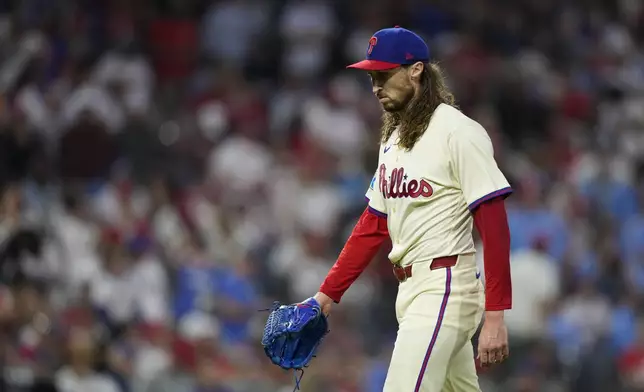 Philadelphia Phillies pitcher Matt Strahm walks to the dugout after being released during the eighth inning of Game 1 of a baseball NL Division Series against the New York Mets, Saturday, Oct. 5, 2024, in Philadelphia. (AP Photo/Matt Slocum)