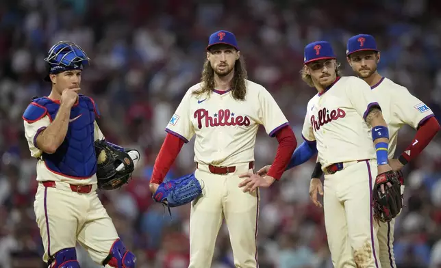 Philadelphia Phillies pitcher Matt Strahm is released during the eighth inning of Game 1 of a baseball NL Division Series against the New York Mets, Saturday, Oct. 5, 2024, in Philadelphia. (AP Photo/Matt Slocum)