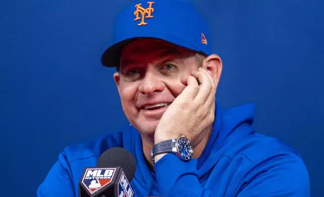 New York Mets manager Carlos Mendoza speaks during a baseball news conference, Friday, Oct. 4, 2024, in Philadelphia, ahead of the National League Division Series against the Philadelphia Phillies. (AP Photo/Chris Szagola)