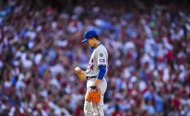 New York Mets Kodai Senga prepares to pitch during the first inning of Game 1 of a baseball NL Division Series against the Philadelphia Phillies, Saturday, Oct. 5, 2024, in Philadelphia. (AP Photo/Matt Slocum)