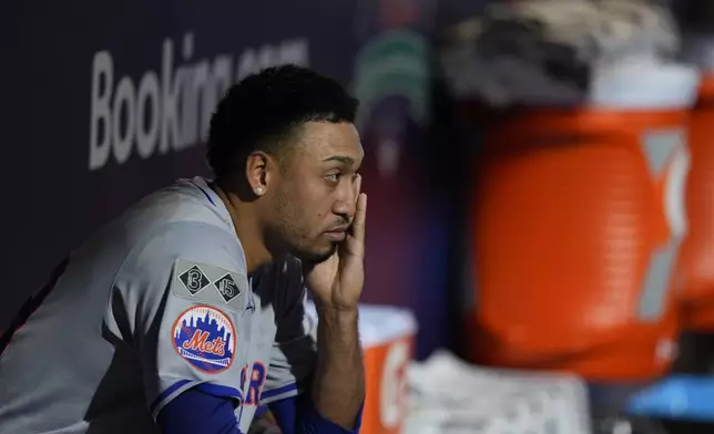 New York Mets pitcher Edwin Díaz looks out of the dugout after being pulled during the eight inning of Game 2 of a baseball NL Division Series against the Philadelphia Phillies, Sunday, Oct. 6, 2024, in Philadelphia. (AP Photo/Chris Szagola)