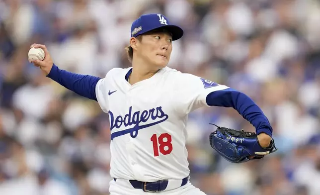 Los Angeles Dodgers starting pitcher Yoshinobu Yamamoto throws to a San Diego Padres batter during the second inning in Game 5 of a baseball NL Division Series Friday, Oct. 11, 2024, in Los Angeles. (AP Photo/Ashley Landis)