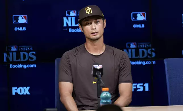 San Diego Padres pitcher Yu Darvish fields questions ahead of Game 5 of a baseball National League Division Series against the Los Angeles Dodgers, Thursday, Oct. 10, 2024, in Los Angeles. (AP Photo/Ashley Landis)