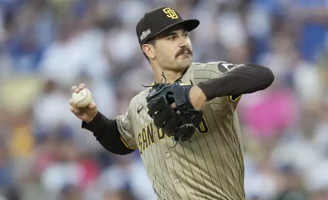 San Diego Padres pitcher Dylan Cease throws to a Los Angeles Dodgers batter during the first inning in Game 1 of baseball's NL Division Series Saturday, Oct. 5, 2024, in Los Angeles. (AP Photo/Ashley Landis)