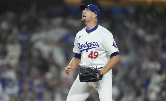 Los Angeles Dodgers pitcher Blake Treinen reacts after striking out San Diego Padres' Manny Machado for the final out of the ninth inning in Game 1 of baseball's NL Division Series, Saturday, Oct. 5, 2024, in Los Angeles. (AP Photo/Mark J. Terrill)