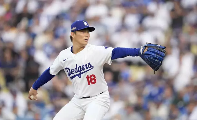 Los Angeles Dodgers starting pitcher Yoshinobu Yamamoto throws to a San Diego Padres batter during the first inning in Game 5 of a baseball NL Division Series Friday, Oct. 11, 2024, in Los Angeles. (AP Photo/Ashley Landis)