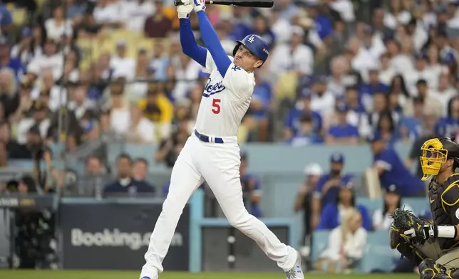 Los Angeles Dodgers' Freddie Freeman flies out during the fourth inning in Game 5 of a baseball NL Division Series against the San Diego Padres, Friday, Oct. 11, 2024, in Los Angeles. (AP Photo/Ashley Landis)