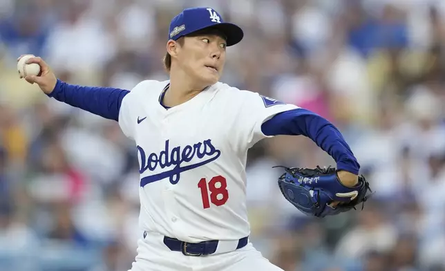 Los Angeles Dodgers pitcher Yoshinobu Yamamoto throws to a San Diego Padres batter during the first inning in Game 1 of baseball's NL Division Series against the San Diego Padres, Saturday, Oct. 5, 2024, in Los Angeles. (AP Photo/Ashley Landis)