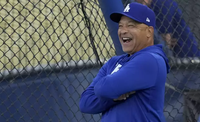 Los Angeles Dodgers manager Dave Roberts reacts during practice ahead of Game 5 of a baseball National League Division Series against the San Diego Padres, Thursday, Oct. 10, 2024, in Los Angeles. (AP Photo/Ashley Landis)