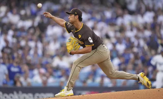 San Diego Padres starting pitcher Yu Darvish throws to a Los Angeles Dodgers batter during the first inning in Game 5 of a baseball NL Division Series Friday, Oct. 11, 2024, in Los Angeles. (AP Photo/Mark J. Terrill)