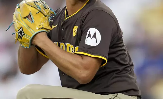 San Diego Padres starting pitcher Yu Darvish throws to a Los Angeles Dodgers batter during the third inning in Game 5 of a baseball NL Division Series Friday, Oct. 11, 2024, in Los Angeles. (AP Photo/Ashley Landis)