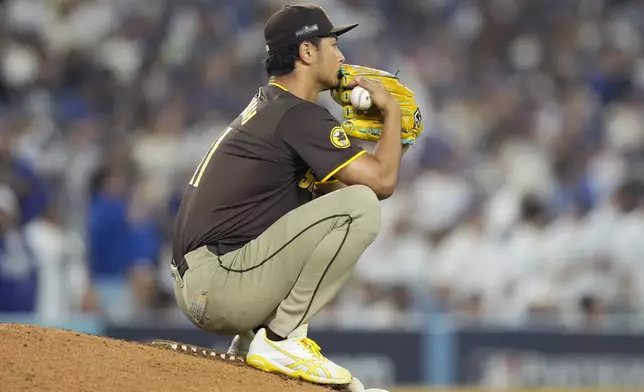 San Diego Padres pitcher Yu Darvish pauses on the mound during the seventh inning in Game 2 of a baseball NL Division Series against the Los Angeles Dodgers, Sunday, Oct. 6, 2024, in Los Angeles. (AP Photo/Mark J. Terrill)