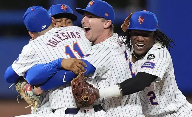 The New York Mets celebrate after defeating the Philadelphia Phillies in Game 4 of the National League baseball playoff series, Wednesday, Oct. 9, 2024, in New York. (AP Photo/Frank Franklin II)