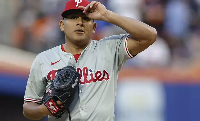 Philadelphia Phillies pitcher Ranger Suárez reacts during the second inning of Game 4 of the National League baseball playoff series against the New York Mets, Wednesday, Oct. 9, 2024, in New York. (AP Photo/Adam Hunger)