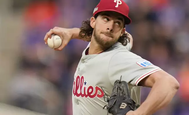 Philadelphia Phillies pitcher Aaron Nola delivers against the New York Mets during the fourth inning of Game 3 of the National League baseball playoff series, Tuesday, Oct. 8, 2024, in New York. (AP Photo/Seth Wenig)