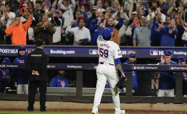 New York Mets pitcher Sean Manaea (59) reacts as he walks off the field during the eighth inning of Game 3 of the National League baseball playoff series against the Philadelphia Phillies, Tuesday, Oct. 8, 2024, in New York. (AP Photo/Seth Wenig)