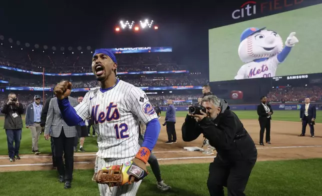 New York Mets shortstop Francisco Lindor (12) celebrates after the Mets beat the Philadelphia Phillies in Game 4 of the National League baseball playoff series, Wednesday, Oct. 9, 2024, in New York. (AP Photo/Adam Hunger)