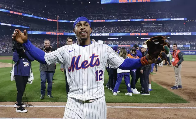 New York Mets shortstop Francisco Lindor (12) celebrates after the Mets beat the Philadelphia Phillies in Game 4 of the National League baseball playoff series, Wednesday, Oct. 9, 2024, in New York. (AP Photo/Adam Hunger)