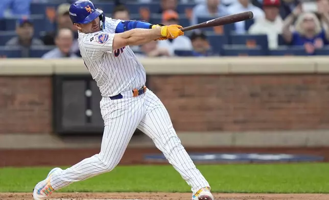 New York Mets Pete Alonso (20) connects for a solo home run against the Philadelphia Phillies during the second inning of Game 3 of the National League baseball playoff series, Tuesday, Oct. 8, 2024, in New York. (AP Photo/Frank Franklin II)