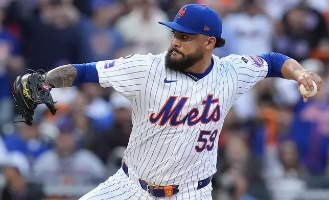 New York Mets pitcher Sean Manaea (59) delivers against the Philadelphia Phillies during the first inning of Game 3 of the National League baseball playoff series, Tuesday, Oct. 8, 2024, in New York. (AP Photo/Frank Franklin II)