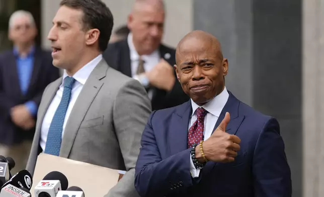 New York City mayor Eric Adams, right, appears with his attorney, Alex Spiro, outside Manhattan federal court after an appearance, Friday, Sept. 27, 2024, in New York. (AP Photo/Julia Demaree Nikhinson)