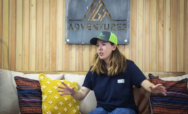 Adriana Brownlee, 23, the youngest woman to scale all the 14 highest mountains in the world, speaks during an interview with The Associated Press, in Kathmandu, Nepal, Thursday, Oct. 17, 2024. (AP Photo/Niranjan Shrestha)