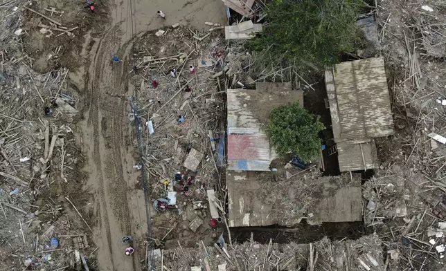 In this aerial image of the Kathmandu valley, debris is seen in Kathmandu, Nepal, Monday, Sept. 30, 2024 in the aftermath of a flood caused by heavy rains. (AP Photo/Gopen Rai)