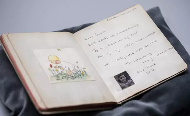 A friendship album with Anne Frank's writing is displayed in Amsterdam, Netherlands, Friday, Oct. 4, 2024, ahead of an exhibit in New York. (AP Photo/Peter Dejong)