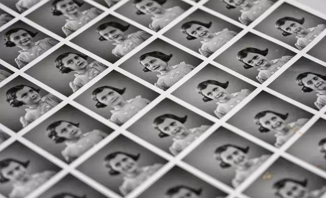 A sheet of pictures of Anne Frank is displayed in Amsterdam, Netherlands, Friday, Oct. 4, 2024, ahead of an exhibit in New York. (AP Photo/Peter Dejong)