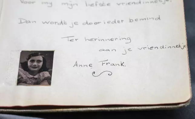 A friendship album with Anne Frank's writing is displayed in Amsterdam, Netherlands, Friday, Oct. 4, 2024, ahead of an exhibit in New York. (AP Photo/Peter Dejong)