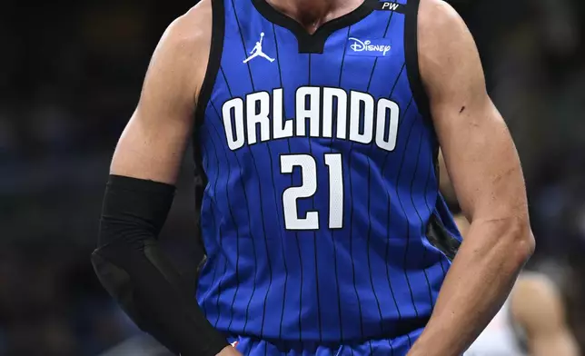 Orlando Magic center Moritz Wagner reacts after dunking during the first half of an NBA basketball game against the Brooklyn Nets, Friday, Oct. 25, 2024, in Orlando, Fla. (AP Photo/Phelan M. Ebenhack)