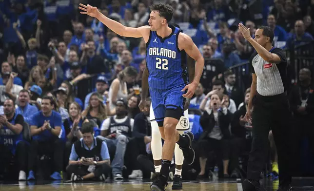 Orlando Magic forward Franz Wagner (22) celebrates after his 3-point basket against the Brooklyn Nets during the first half of an NBA basketball game, Friday, Oct. 25, 2024, in Orlando, Fla. (AP Photo/Phelan M. Ebenhack)