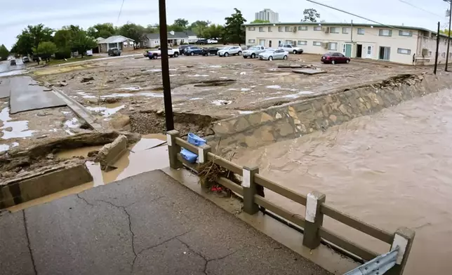 In this image taken from video, debris and damage and are seen from severe flooding in Roswell, N.M., Sunday, Oct. 20, 2024. (Juliana Halvorson via AP)