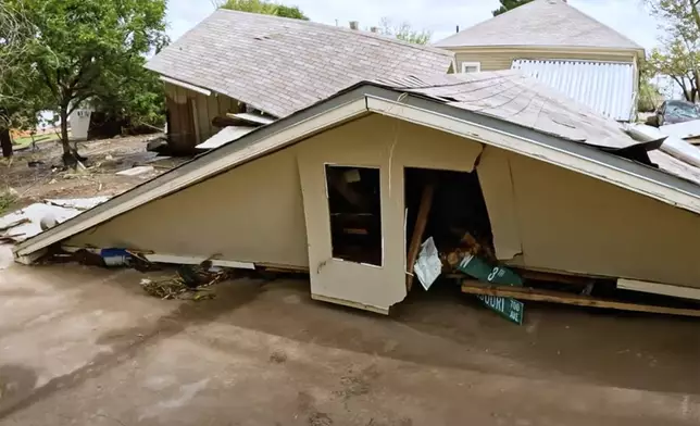 In this image taken from video, debris and damage and are seen from severe flooding in Roswell, N.M., Sunday, Oct. 20, 2024. (Juliana Halvorson via AP)