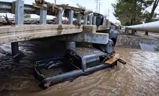 In this image taken from video, debris and damage and are seen from severe flooding in Roswell, N.M., Sunday, Oct. 20, 2024. (Juliana Halvorson via AP)