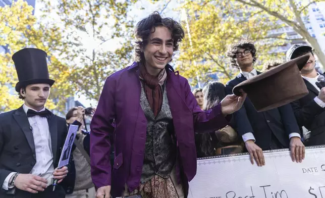 Miles Mitchell, 21, winner of the Timothee Chalamet lookalike contest near Washington Square Park, Sunday, Oct. 27, 2024, in New York. (AP Photo/Stefan Jeremiah)