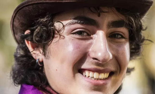 Miles Mitchell, 21, winner of the Timothee Chalamet lookalike contest near Washington Square Park, Sunday, Oct. 27, 2024, in New York. (AP Photo/Stefan Jeremiah)