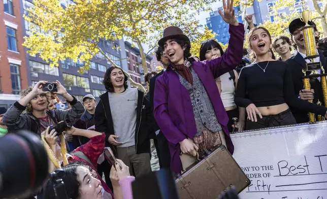 Miles Mitchell, 21, winner of the Timothee Chalamet lookalike contest near Washington Square Park, Sunday, Oct. 27, 2024, in New York. (AP Photo/Stefan Jeremiah)