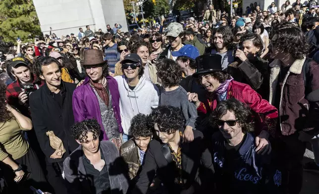 Contestants gather for the Timothee Chalamet lookalike contest in Washington Square Park, Sunday, Oct. 27, 2024, in New York. (AP Photo/Stefan Jeremiah)