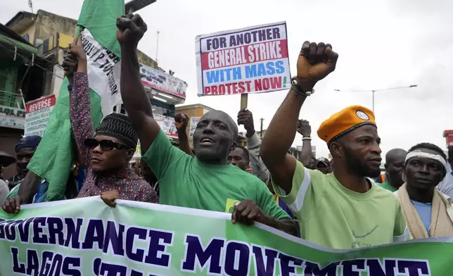 People protest against economic hardship on the occasion of Nigeria's 64th independence anniversary, in Lagos Nigeria, Tuesday, Oct. 1, 2024. (AP Photo/ Sunday Alamba)