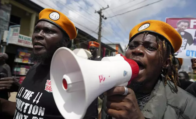 People protest against economic hardship on the occasion of Nigeria's 64th independence anniversary, in Lagos Nigeria, Tuesday, Oct. 1, 2024. (AP Photo/ Sunday Alamba)