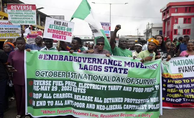 People protest against economic hardship on the occasion of Nigeria's 64th independence anniversary, in Lagos Nigeria, Tuesday, Oct. 1, 2024. (AP Photo/ Sunday Alamba)