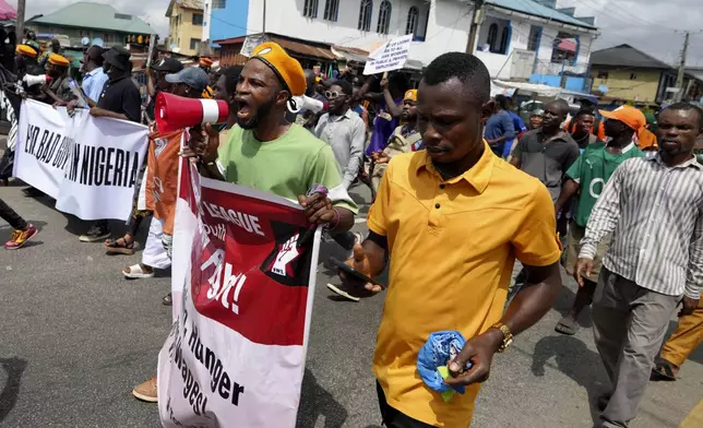 People protest against economic hardship on the occasion of Nigeria's 64th independence anniversary, in Lagos Nigeria, Tuesday, Oct. 1, 2024. (AP Photo/ Sunday Alamba)