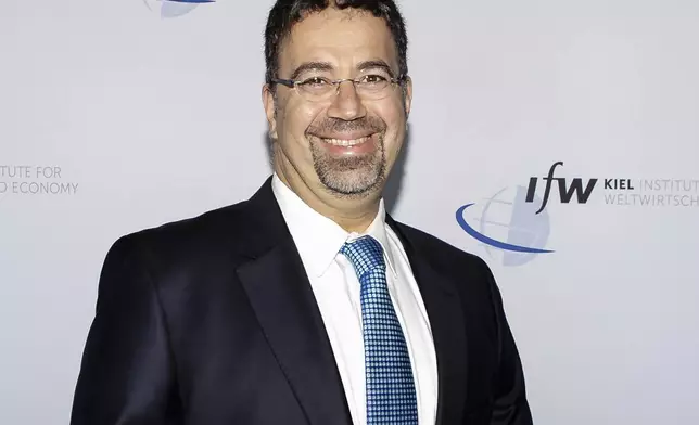 FILE - Daron Acemoglu of the Massachusetts Institute of Technology smiles in this image taken on June 22, 2019 in Kiel, Germany, as he and Simon Johnson and James A. Robinson won the Nobel prize in economics for research into reasons why some countries succeed and others fail. (Frank Molter, dpa via AP, File)